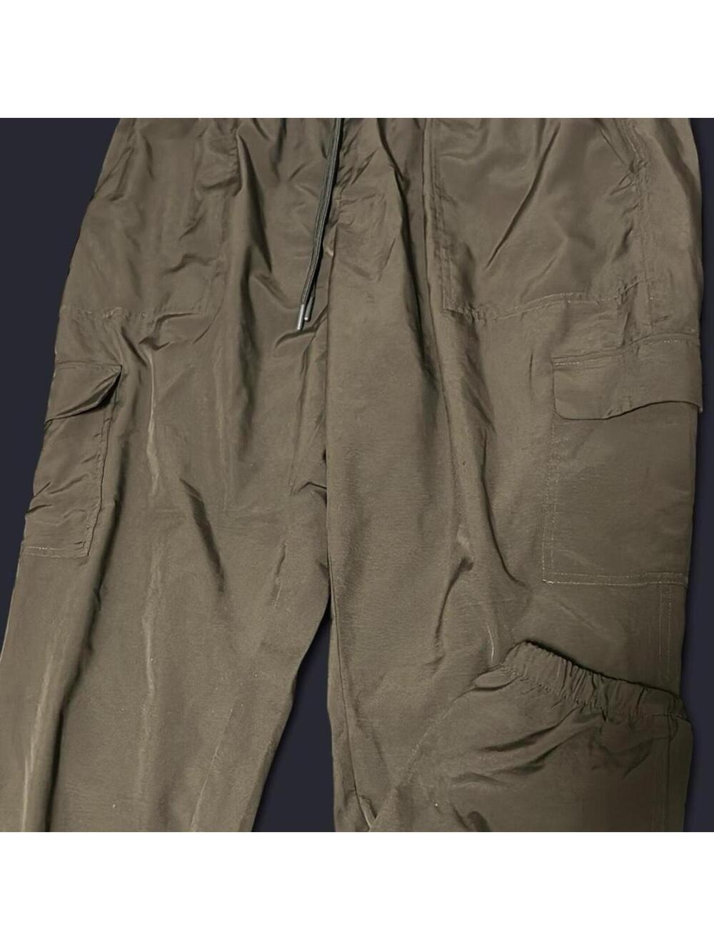 Stretchtech pants with zipper pockets and adjustable waistband. Size: XL